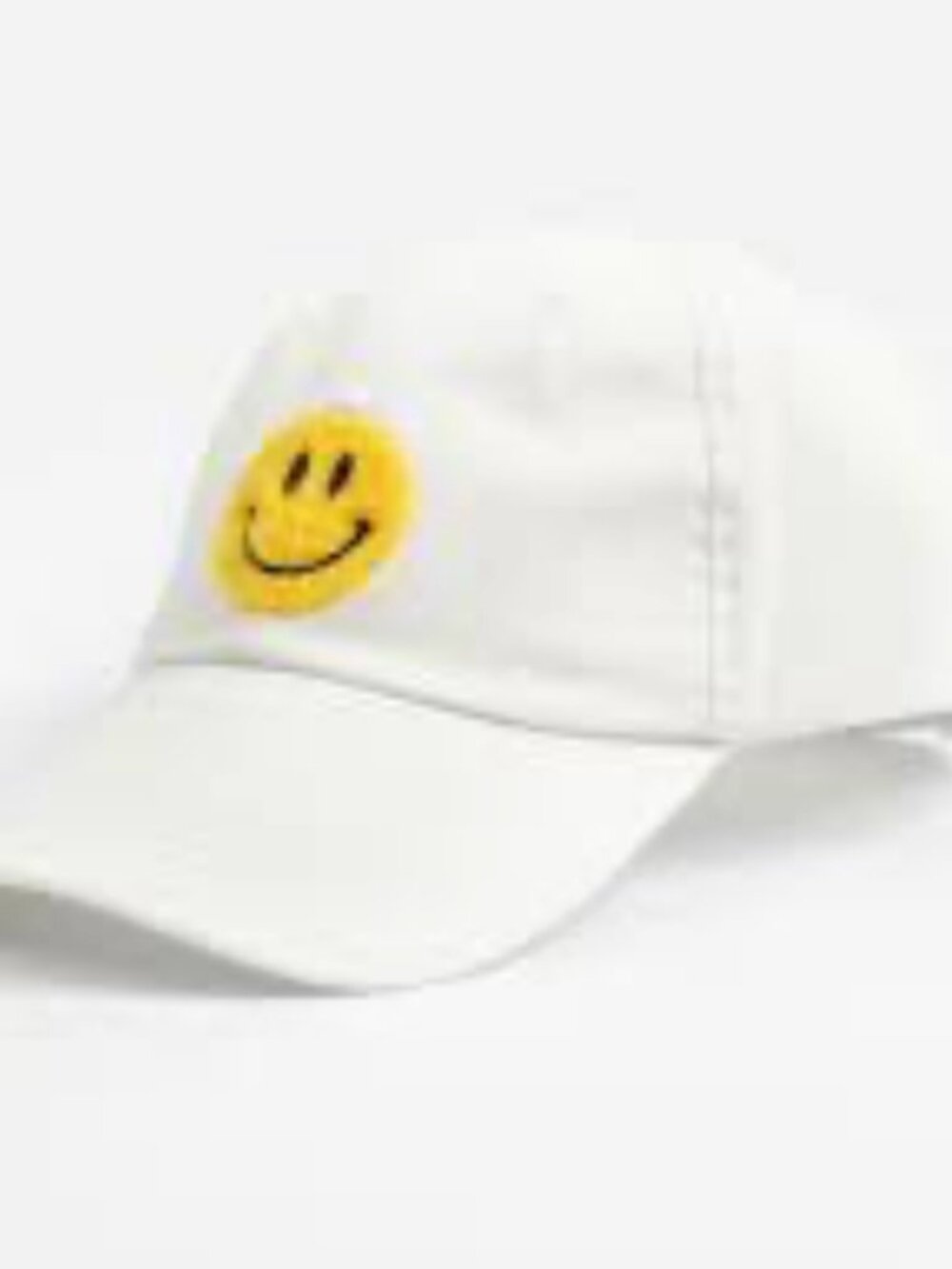 White baseball cap with yellow smiley face.